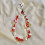 Get CHERRY Happy - Cherry Charm Beaded Phone Wrist Strap